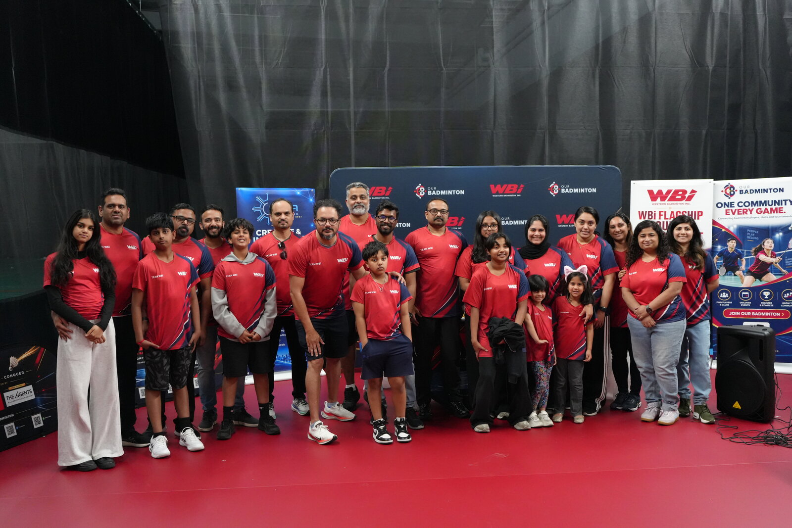 Team WBi together in red club shirts at the WBi Flagship Doubles Tournament 2026