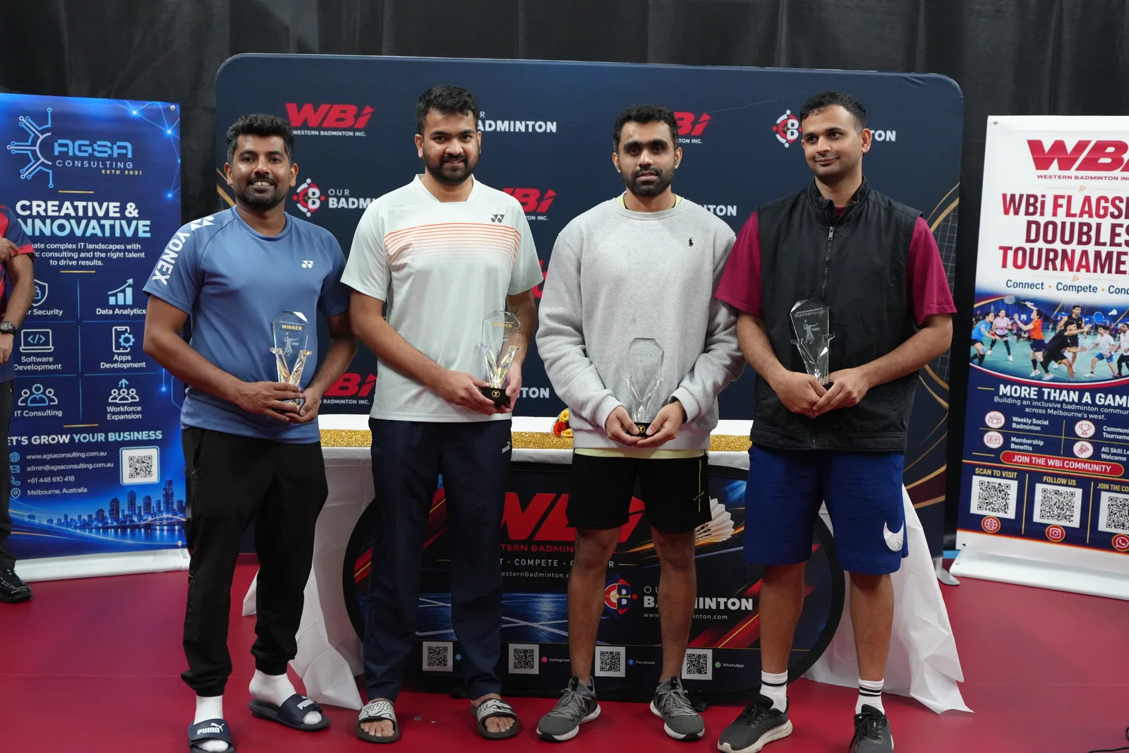 Men’s Doubles Below 40 winners and runners-up holding their trophies